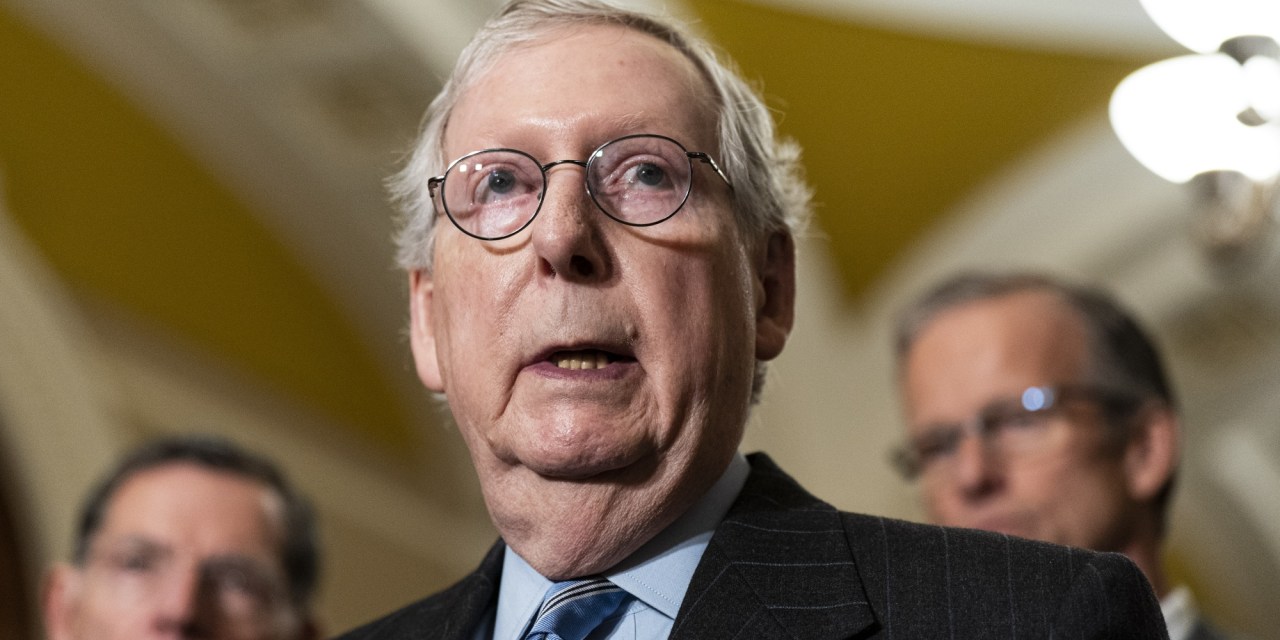 Mitch McConnell freezes at start of Senate GOP leadership press conference and is escorted to the side by his colleagues.
