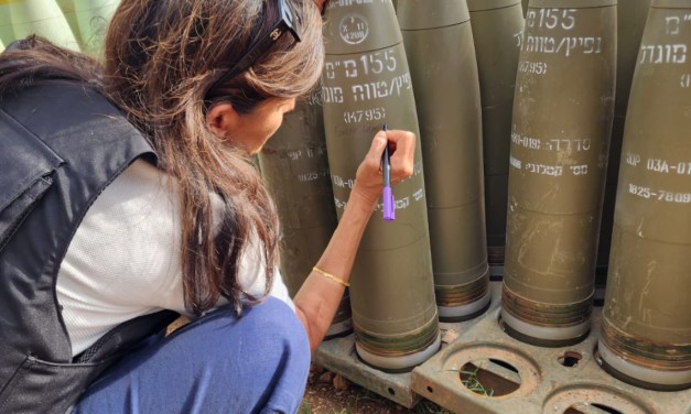 WARNING GRAPHIC IMAGES ***  Nikki Hailey in Israel writing “FINISH THEM” on artillery shells that Israel is about to fire into Rafah, in violation of the International Court of Justice’s order.